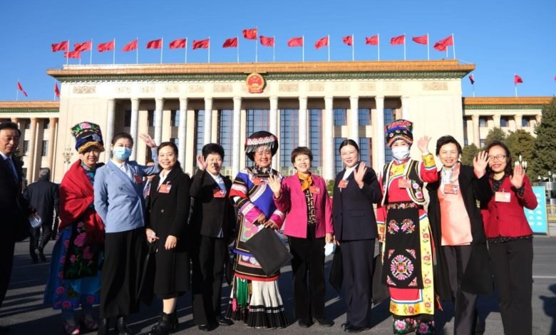 Deputies to the National People’s Congress (NPC) pose for a picture in front of the Great Hall of the People. The fifth session of the 13th NPC kicks off at the Great Hall of the People in Beijing, March 5, 2022. (Photo by Guo Junfeng/People’s Daily Online)