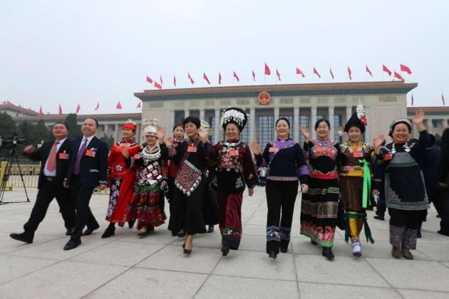 Deputies to the 13th National People’s Congress (NPC) walk out of the Great Hall of the People in Beijing after the closing meeting of the fifth session of the 13th NPC, March 11, 2022. (Photo by Guo Junfeng/People’s Daily Online)