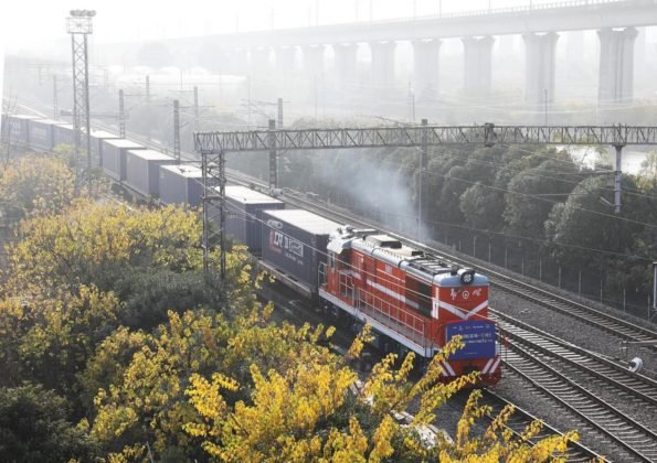 A freight train of the China-Laos Railway departs from Yiwu, east China's Zhejiang province for Vientiane, carrying 70 standard containers of goods, Dec. 13, 2021. (Photo by Gong Xianming/People's Daily Online)