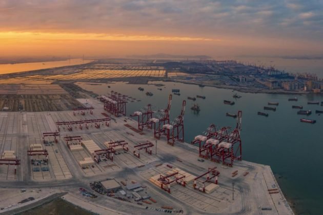 Photo taken on Dec. 7, 2021 shows the fourth phase of the Nansha Port project under construction in south China’s Guangdong province, the first fully automated terminal in the Guangdong-Hong Kong-Macao Greater Bay Area. (Photo by Qiu Xinsheng/People’s Daily Online)