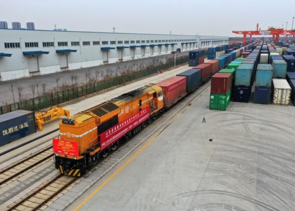 A China-Europe freight train loaded with 100 twenty-foot equivalent units of different types of goods, including chemical raw materials, vehicle accessories, and daily necessities, leaves a multimodal transportation center at China-SCO Local Economic and Trade Cooperation Demonstration Zone in Jiaozhou city, east China’s Shandong province, for Mannheim, Germany, Feb. 18, 2022. (Photo by Wang Zhaomai/People’s Daily Online)